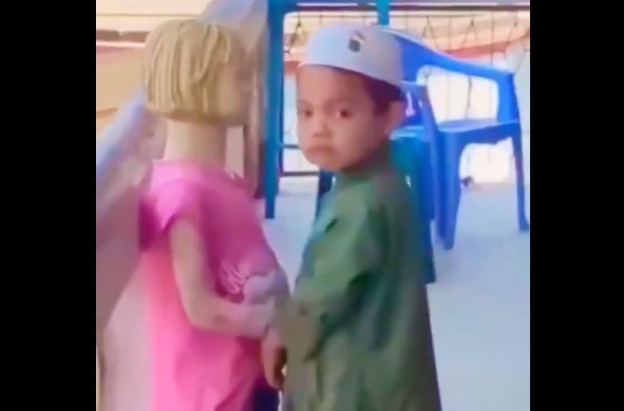 Someone Please Save the Mannequin From this Little Muslim Boy!